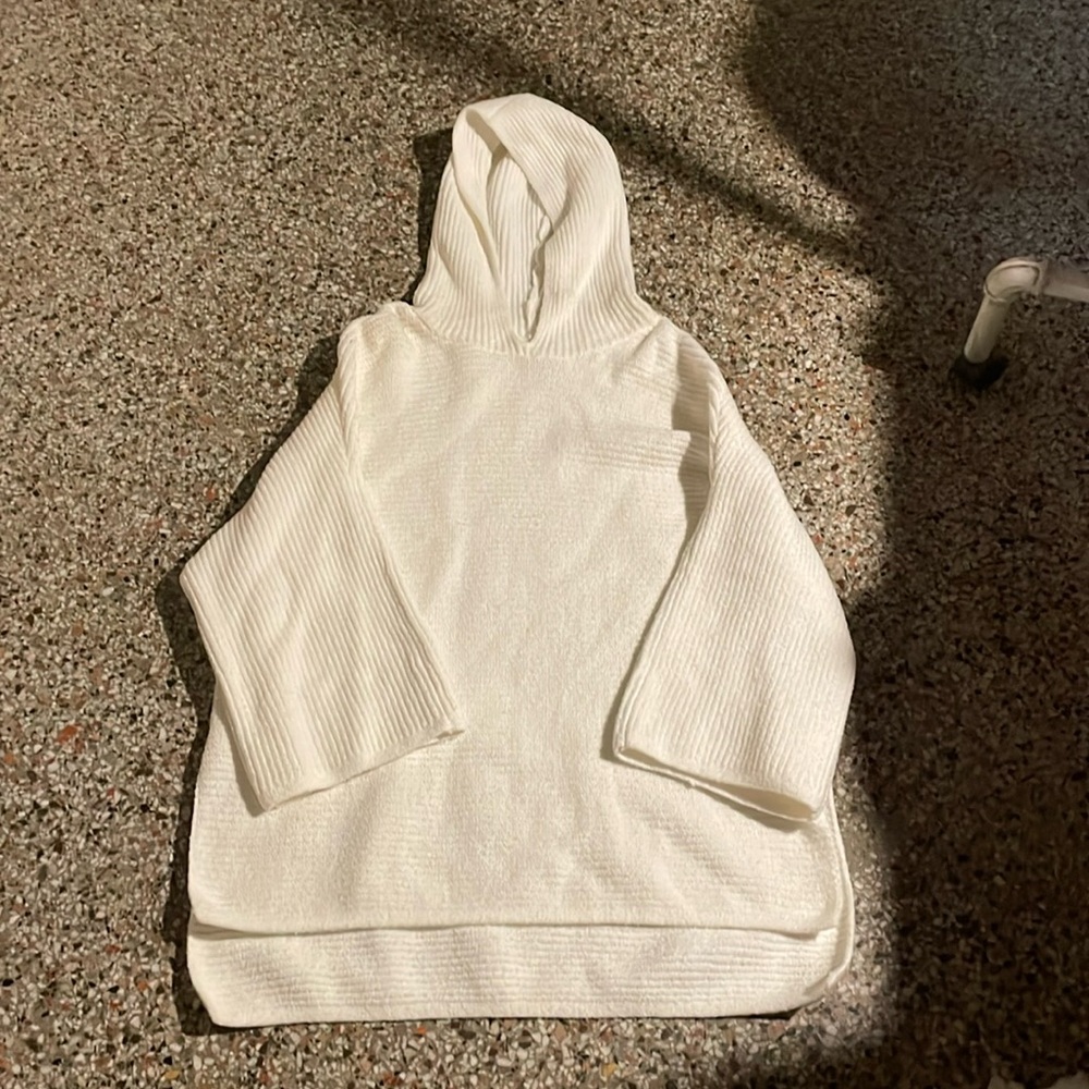 NWOT white colored hoodie sweater; women’s L ; 3/4 big sleeves & high low hem.